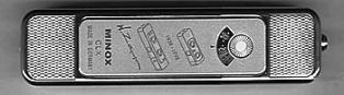 Delne telpantis portatyvinis fotoaparatas 350px-Minox CLX BACK su išradėjo Valterio Capos autografu